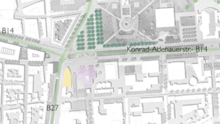 Ein Stadtplan in Graustufen, der die Konrad-Adenauer-Straße (B14), B27, Straßen, Gebäude und Grünflächen hervorhebt; in der Nähe einer Kreuzung sind eine gelbe und eine violette Form darübergelegt.