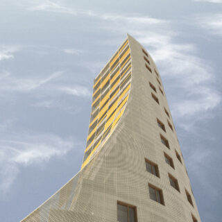 Ein hohes, modernes Gebäude mit geschwungener Fassade und perforierten Außenpaneelen vor einem blauen Himmel mit leichten Wolken.