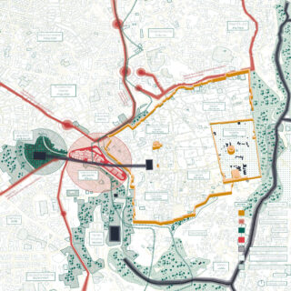 Detaillierter Stadtplan mit Straßen, Grünflächen, Gebäuden und hervorgehobenen Zonen mit Symbolen und farbigen Grenzen; auf der rechten Seite ist ein Fluss sichtbar.