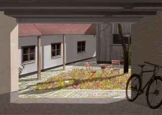 Blick von einer schattigen Garage oder einem Durchgang auf einen Innenhof mit einem kleinen Wildblumengarten, einem orangefarbenen Tisch und Stühlen und einem Fahrrad im Vordergrund.