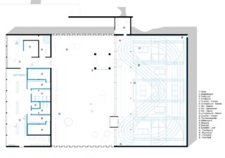 Architektonischer Grundriss, der ein Gebäude mit Toiletten, Umkleideräumen und Versorgungsbereichen auf der linken Seite und einer mehrspurigen Indoor-Laufbahn auf der rechten Seite zeigt; Legenden kennzeichnen jeden Bereich.