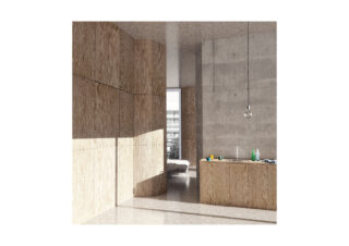 Modernes, minimalistisches Interieur mit Sperrholzschränken, Betonwänden, einer Kücheninsel mit Flaschen und Geschirr, einer hängenden Glühbirne und Sonnenlicht, das Schatten wirft; im Hintergrund ist ein Bett zu sehen.