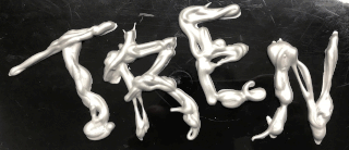 Weiße Rasiercreme hat die Form, auf einer schwarzen Fläche das Wort „TREN“ zu bilden.