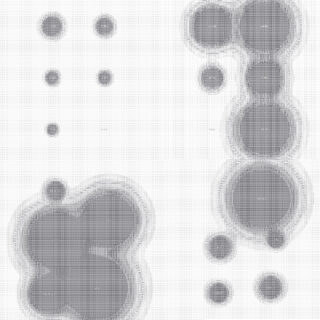 Ein Graustufenraster zeigt Gruppen überlappender, verschwommener Kreise in unterschiedlichen Größen, die vertikal auf der linken und rechten Seite des Bildes angeordnet sind.