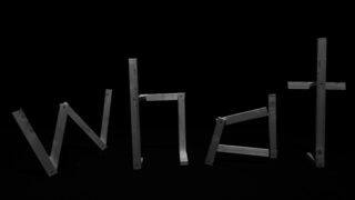 Auf schwarzem Hintergrund angeordnete Holzbretter bilden das Wort „Was“.